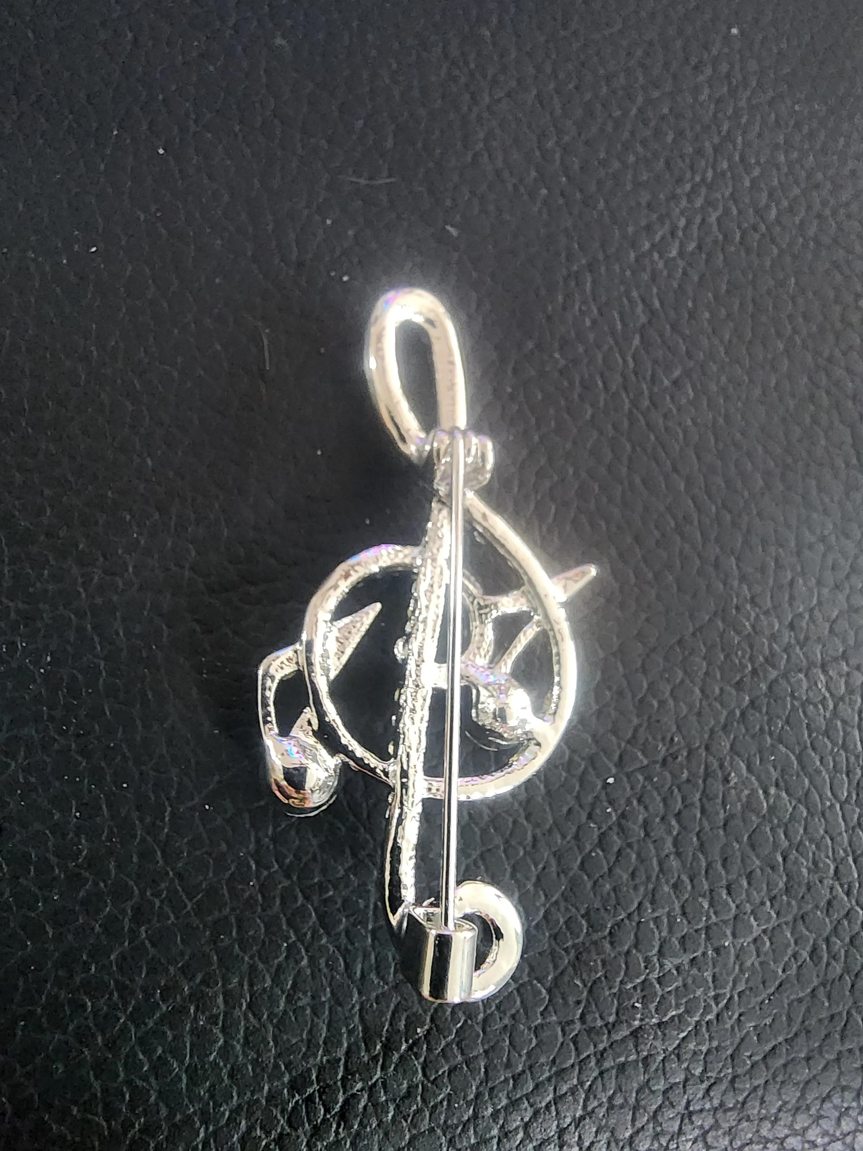 Sparkling Musical Elegance: Rhinestone Treble Clef Brooch